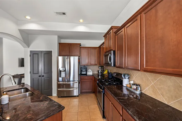 a view of a livingroom with furniture and a flat screen tv