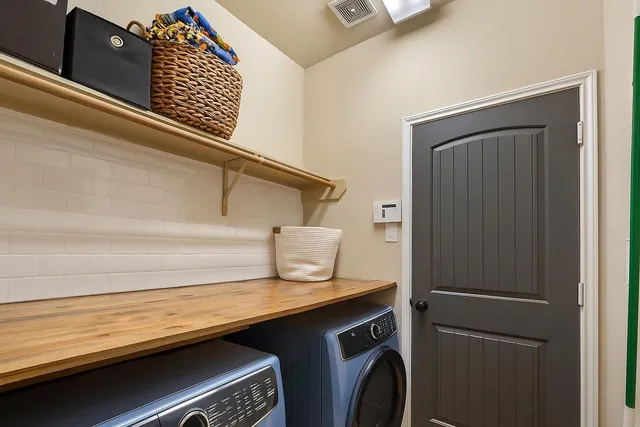 a kitchen with a refrigerator and a sink