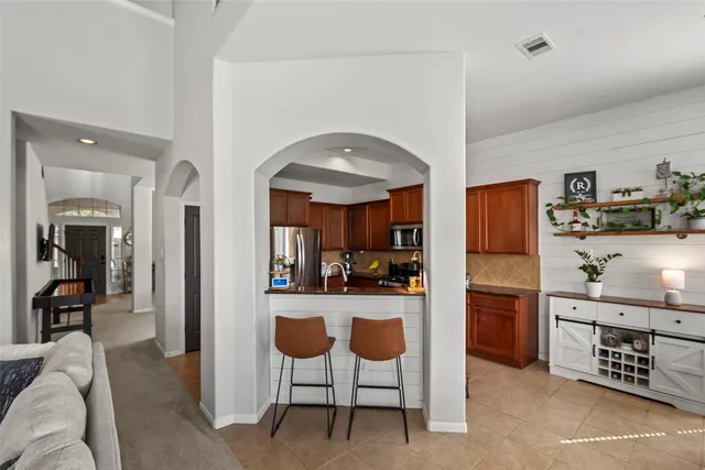 a living room with a couch and a window