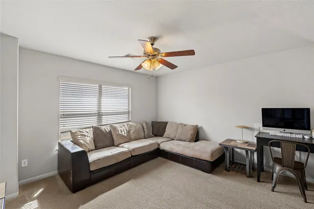 a bedroom with furniture a bed and a chandelier