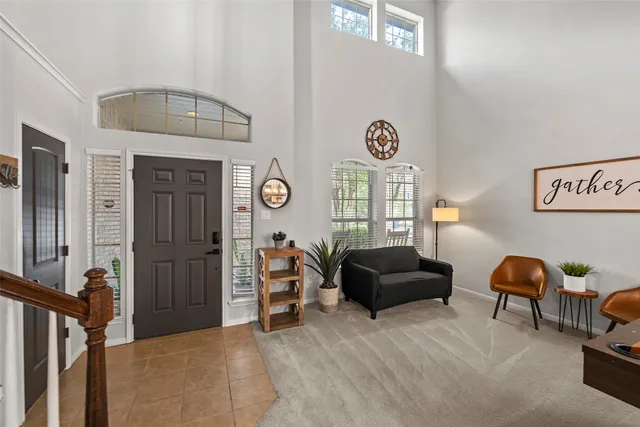 a bedroom with furniture and a window