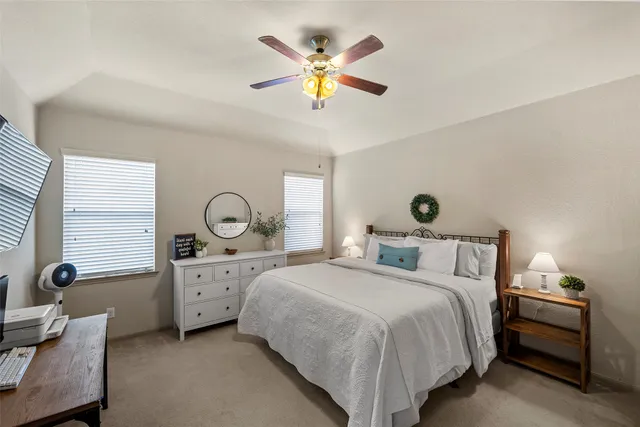 a bathroom with a double vanity sink a mirror and a shower