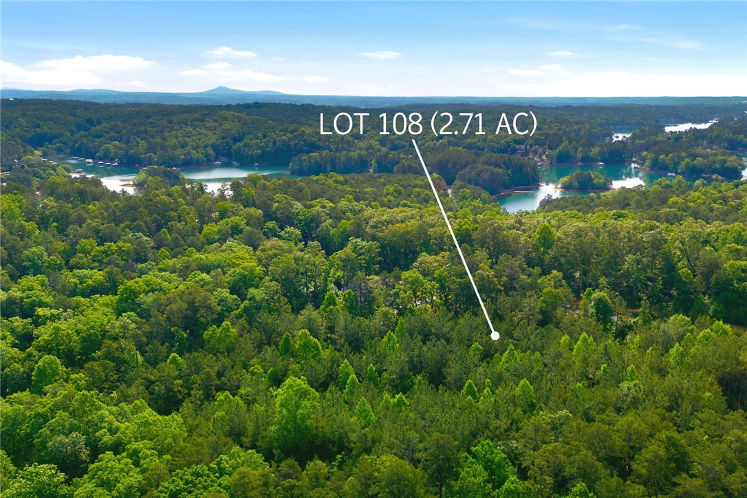 Lot 108 Harbor Ridge Road Seneca, SC 29672 - Photo 8 of 13 This expansive lot offers a tranquil retreat surrounded by lush greenery and serene water views.