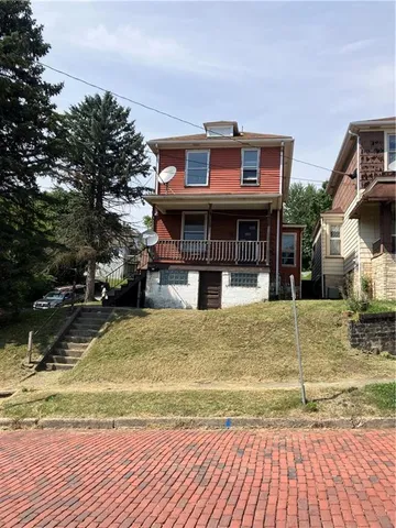 a view of a house with basketball court
