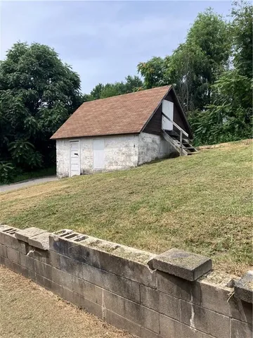 a view of a terrace with wooden floor and a yard