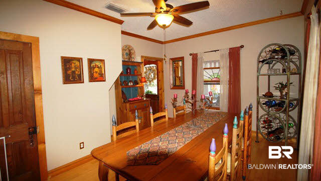 16220 Highway 104 Silverhill, AL 36576 - Photo 8 of 25 Dining Room with Wood flooring and Crown Molding