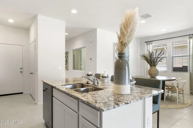 a kitchen with a sink and cabinets