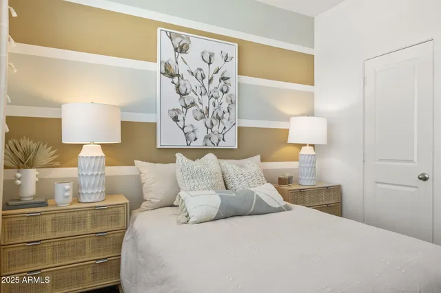 a bed room with a bed and a lamp