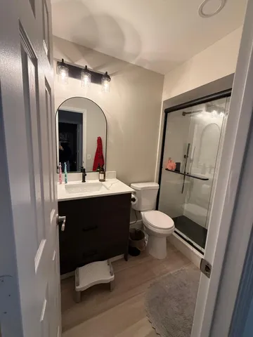 a bathroom with a sink toilet and shower