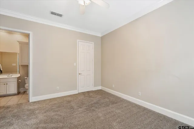 an empty room with a bathroom