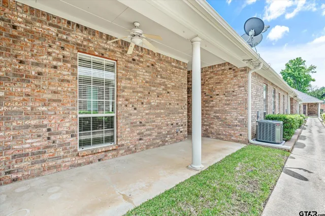 a view of house with backyard