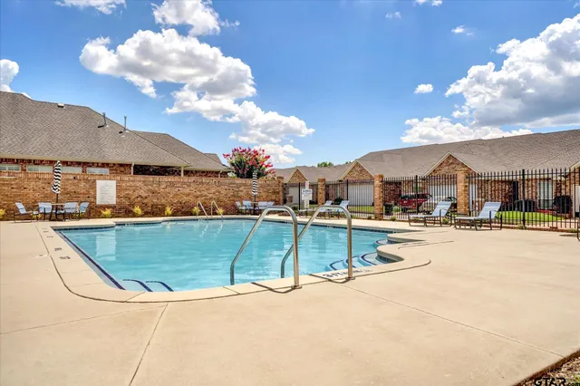 a view of a house with swimming pool and mountains