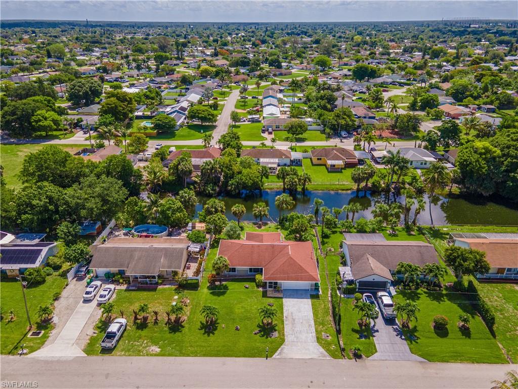 2100 55th Street Southwest Naples, FL 34116 - Photo 5 of 50 an aerial view of residential houses with outdoor space and street view