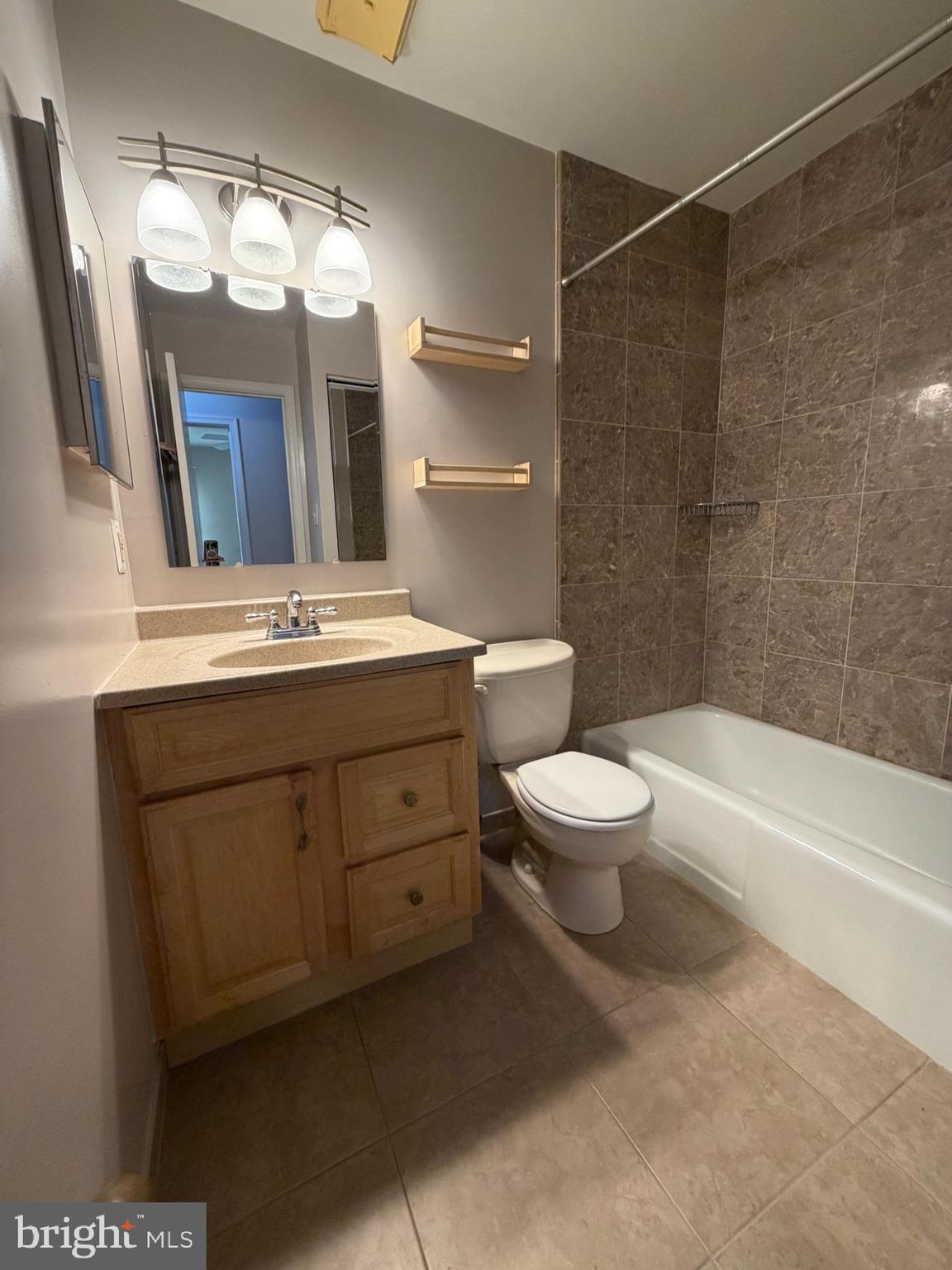 7910 Richfield Road Springfield, VA 22153 - Photo 13 of 14 a bathroom with a double vanity sink mirror bathtub and toilet