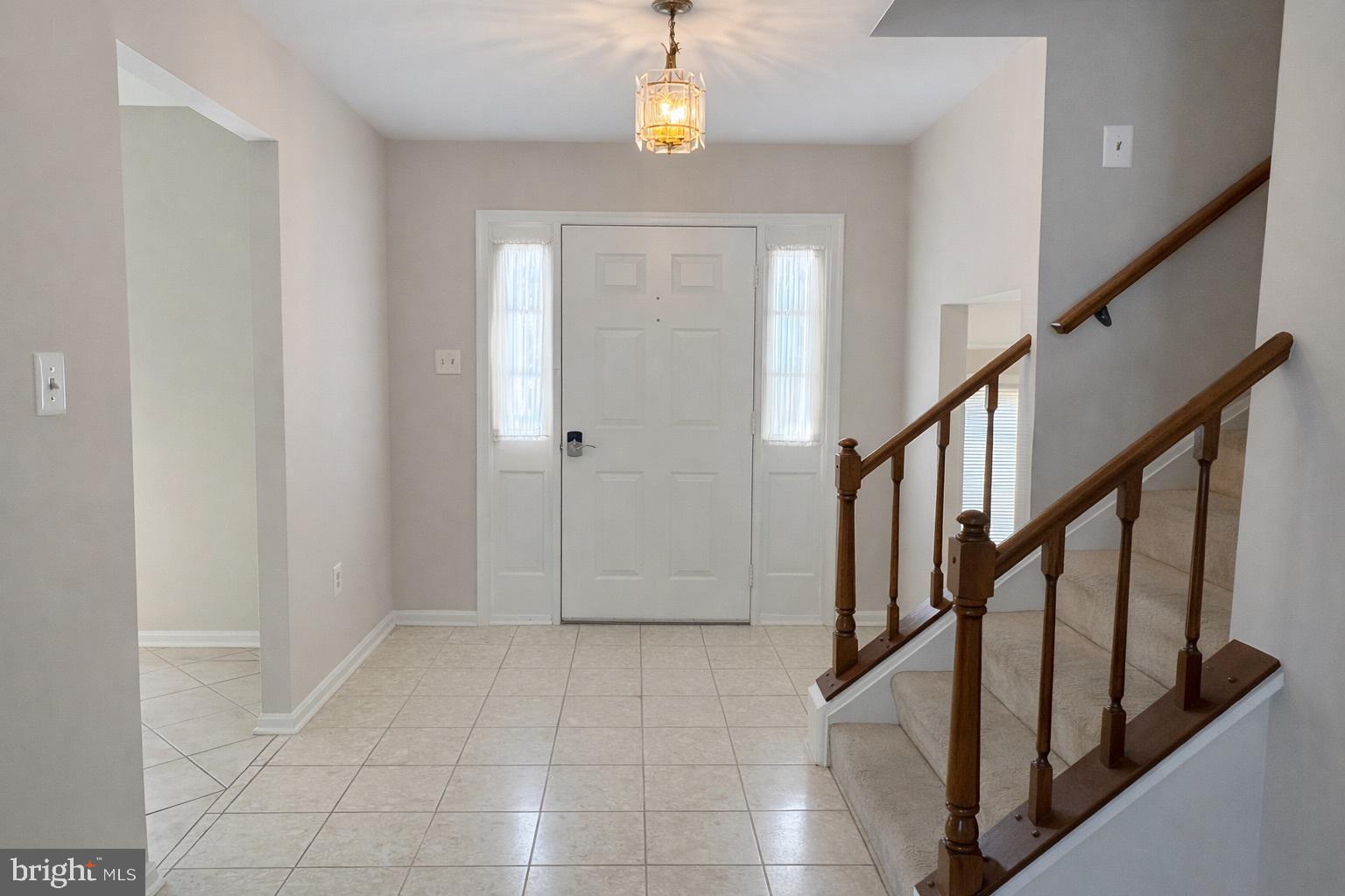 7910 Richfield Road Springfield, VA 22153 - Photo 2 of 14 a view of an entryway with wooden floor
