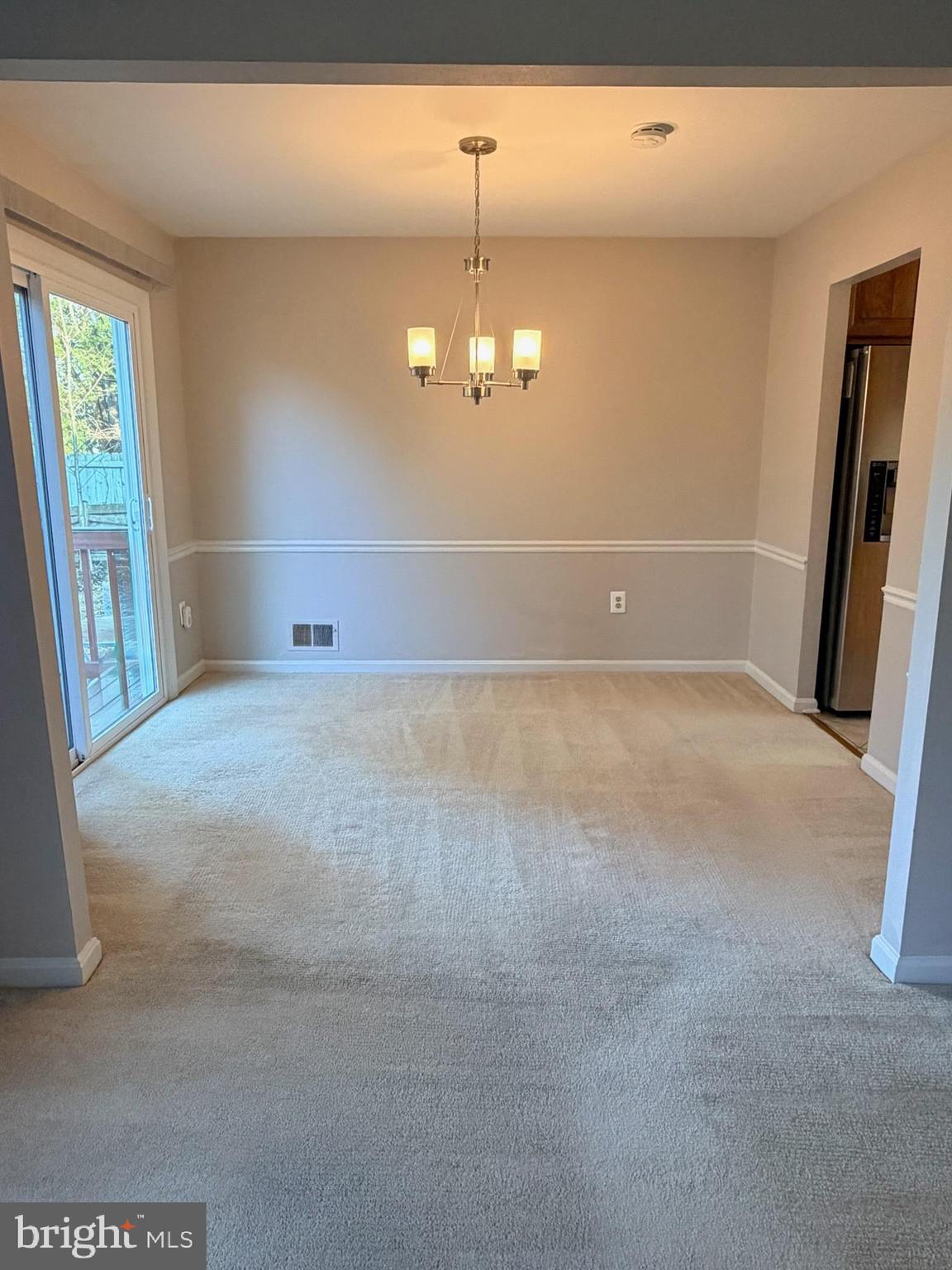 7910 Richfield Road Springfield, VA 22153 - Photo 6 of 14 en empty room with windows and entrance
