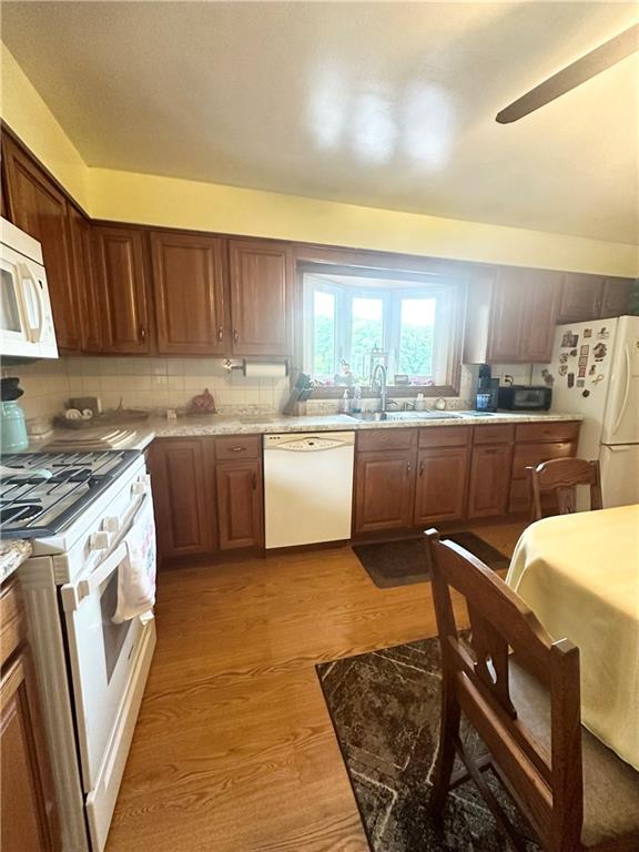 128 Johnetta Road Vandergrift, PA 15690 - Photo 15 of 32 a kitchen with stainless steel appliances granite countertop a sink stove and refrigerator
