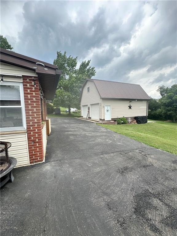 128 Johnetta Road Vandergrift, PA 15690 - Photo 5 of 32 a view of a house with a patio and a yard