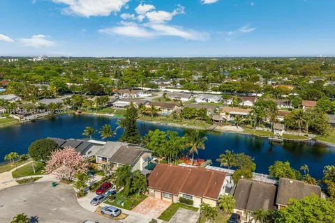 an aerial view of a city with lawn chairs