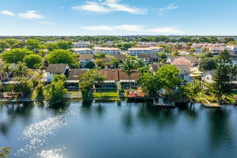 an aerial view of a house with a lake view