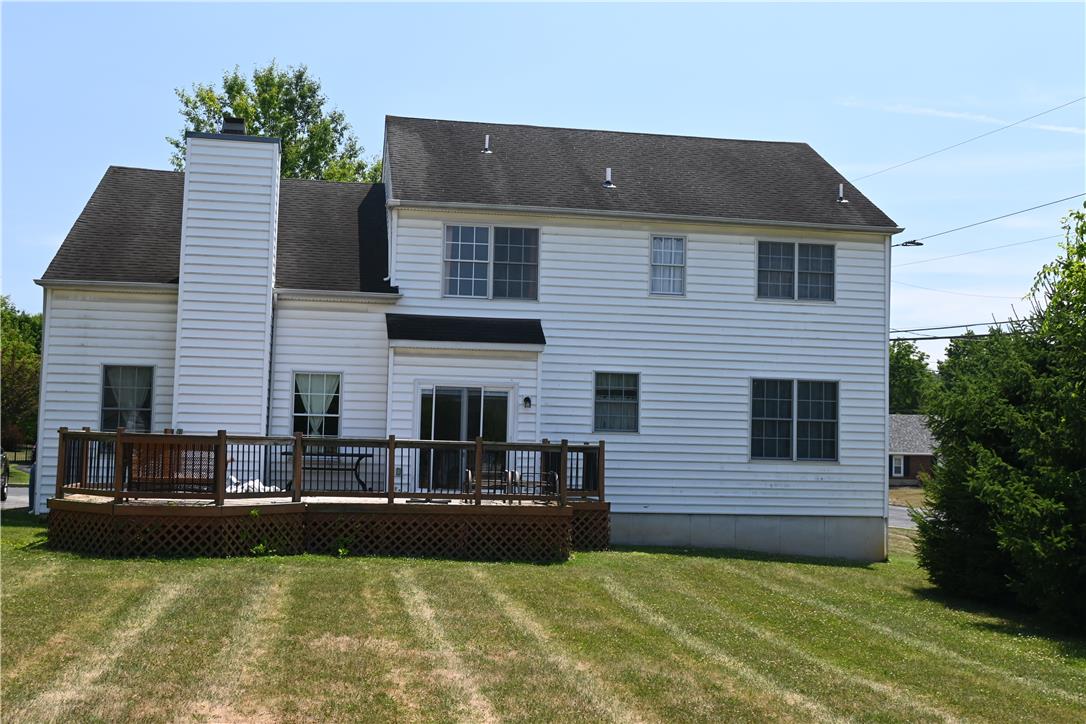 3829 East Hopewell Road Center Valley, PA 18034 - Photo 50 of 52 A spacious wooden deck extends from this classic white-sided home, offering an inviting outdoor entertainment area.