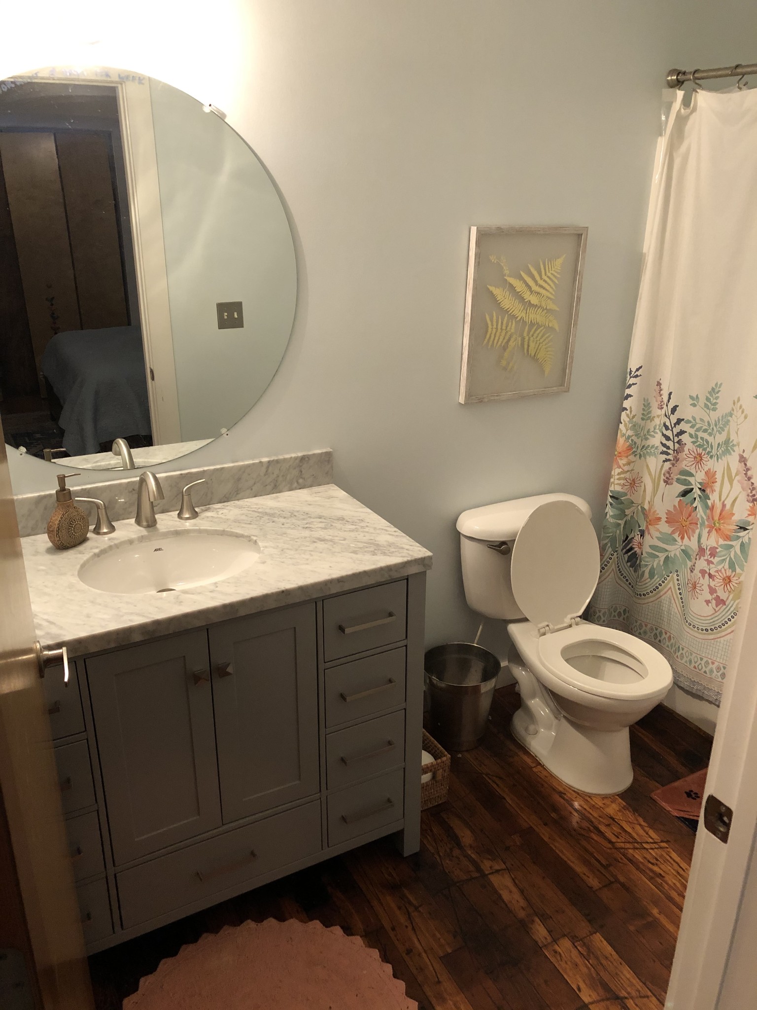 1350 Rosa L Parks Boulevard, Unit 239 Nashville, TN 37208 - Photo 15 of 23 a bathroom with a toilet sink and mirror