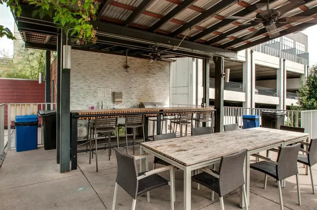 a view of a dinning table and chairs in patio
