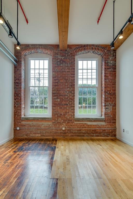 1350 Rosa L Parks Boulevard, Unit 239 Nashville, TN 37208 - Photo 5 of 23 a view of a room with wooden floor and front door