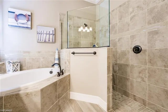 a bathroom with a bathtub and shower