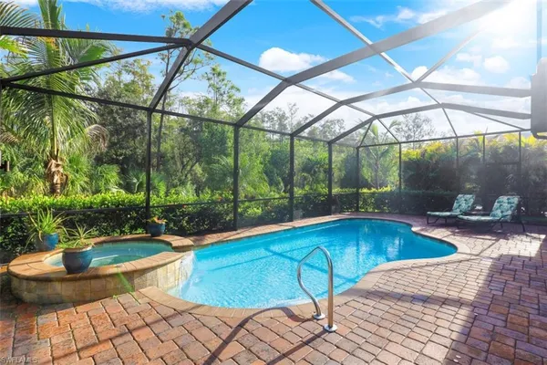 a view of swimming pool with seating space