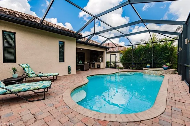 a view of a swimming pool with a patio