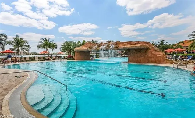 a view of a swimming pool with a yard