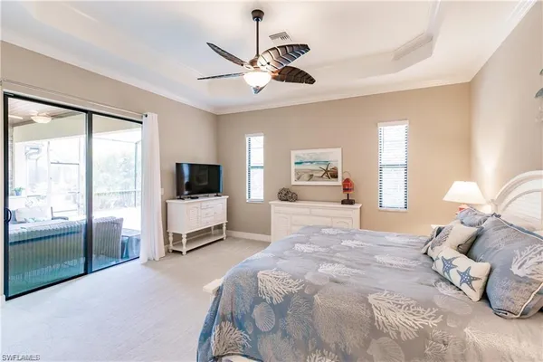 a bedroom with a large bed and a tv