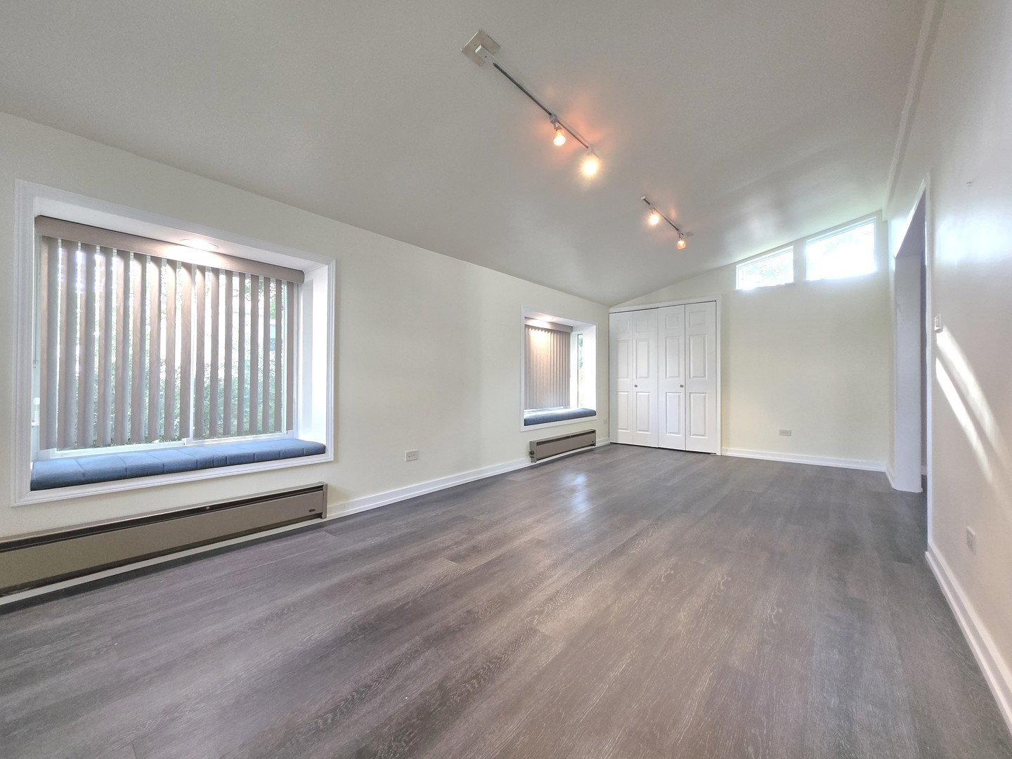 4946 Somerton Drive Hoffman Estates, IL 60010 - Photo 15 of 32 a view of empty room with wooden floor and fan