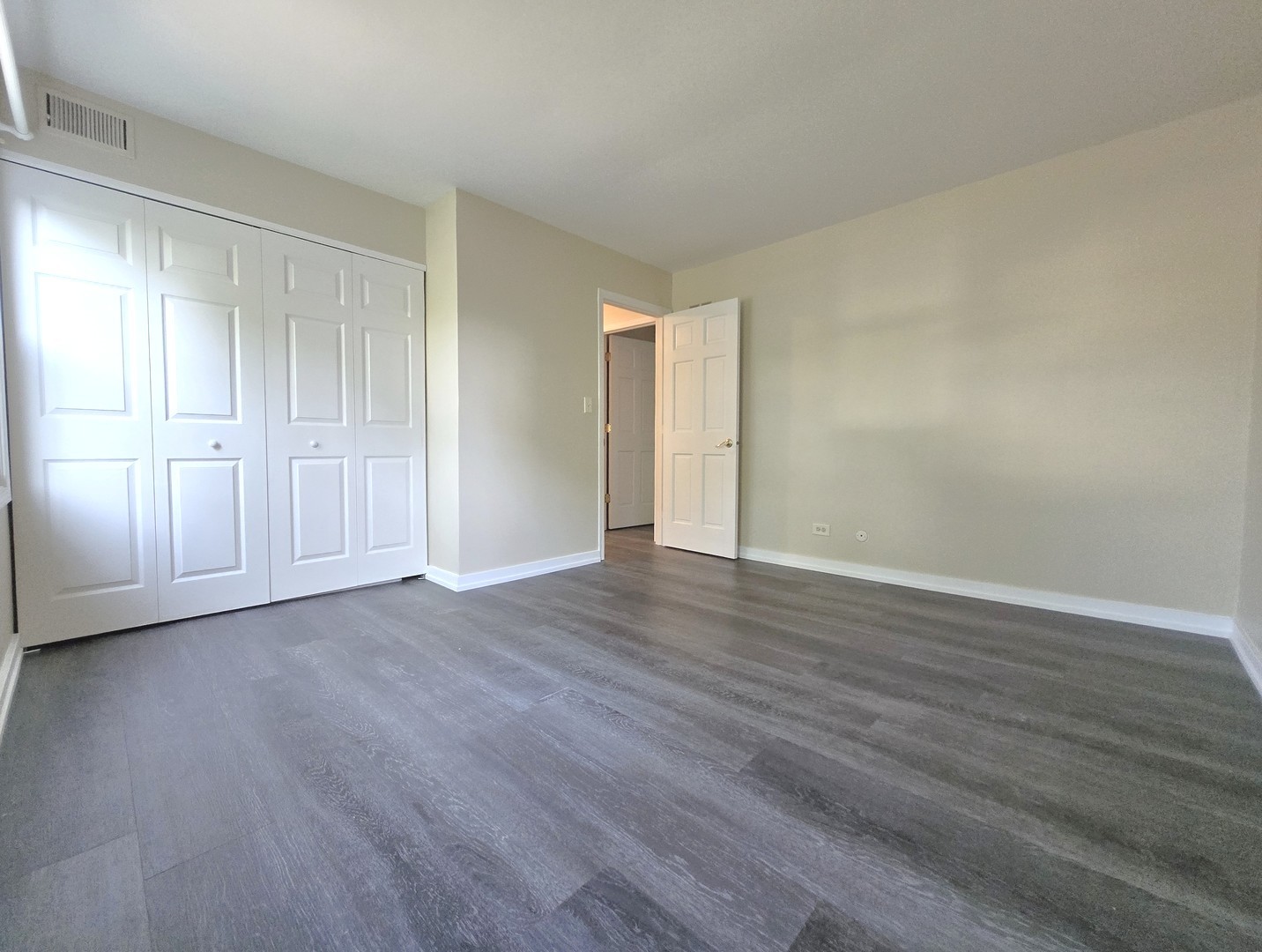 4946 Somerton Drive Hoffman Estates, IL 60010 - Photo 26 of 32 a view of an empty room and wooden floor