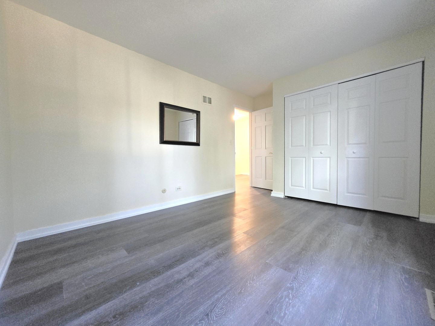 4946 Somerton Drive Hoffman Estates, IL 60010 - Photo 28 of 32 a view of a room with wooden floor and closet