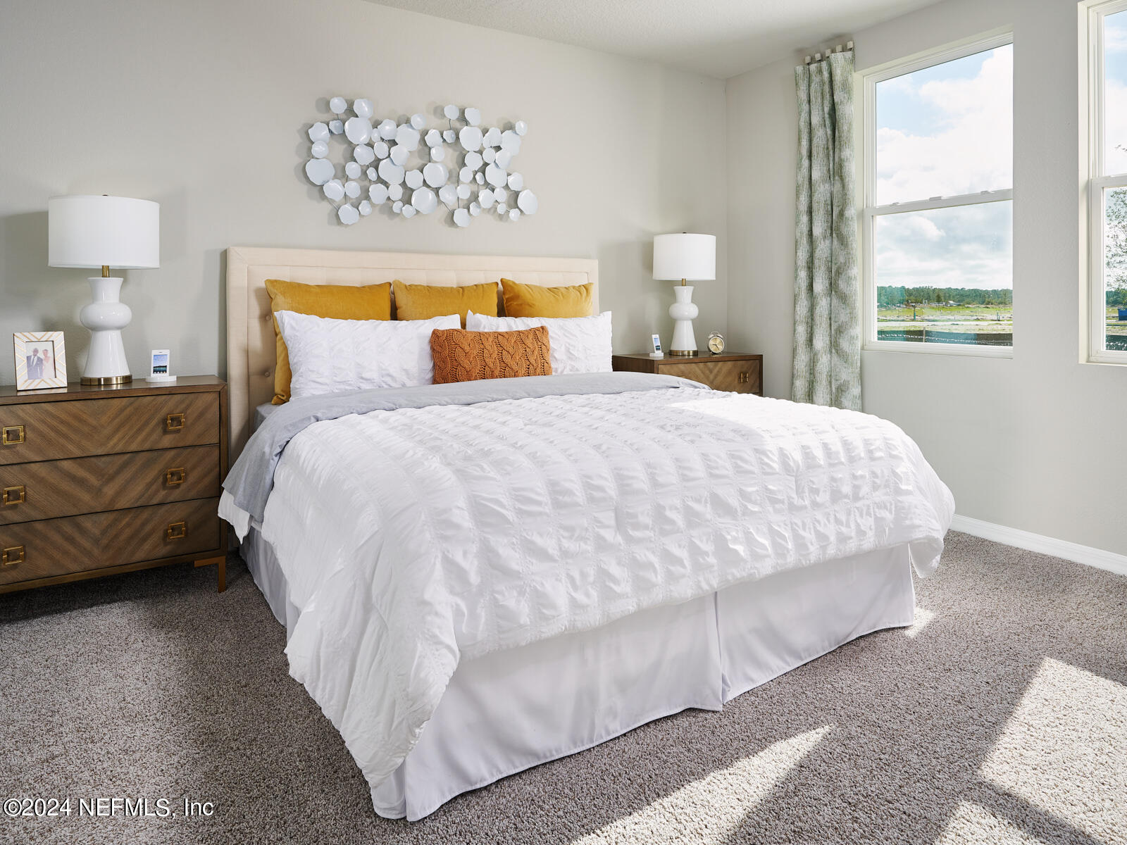 7435 Queensgate Circle Jacksonville, FL 32219 - Photo 6 of 9 a bedroom with bed and a night stand