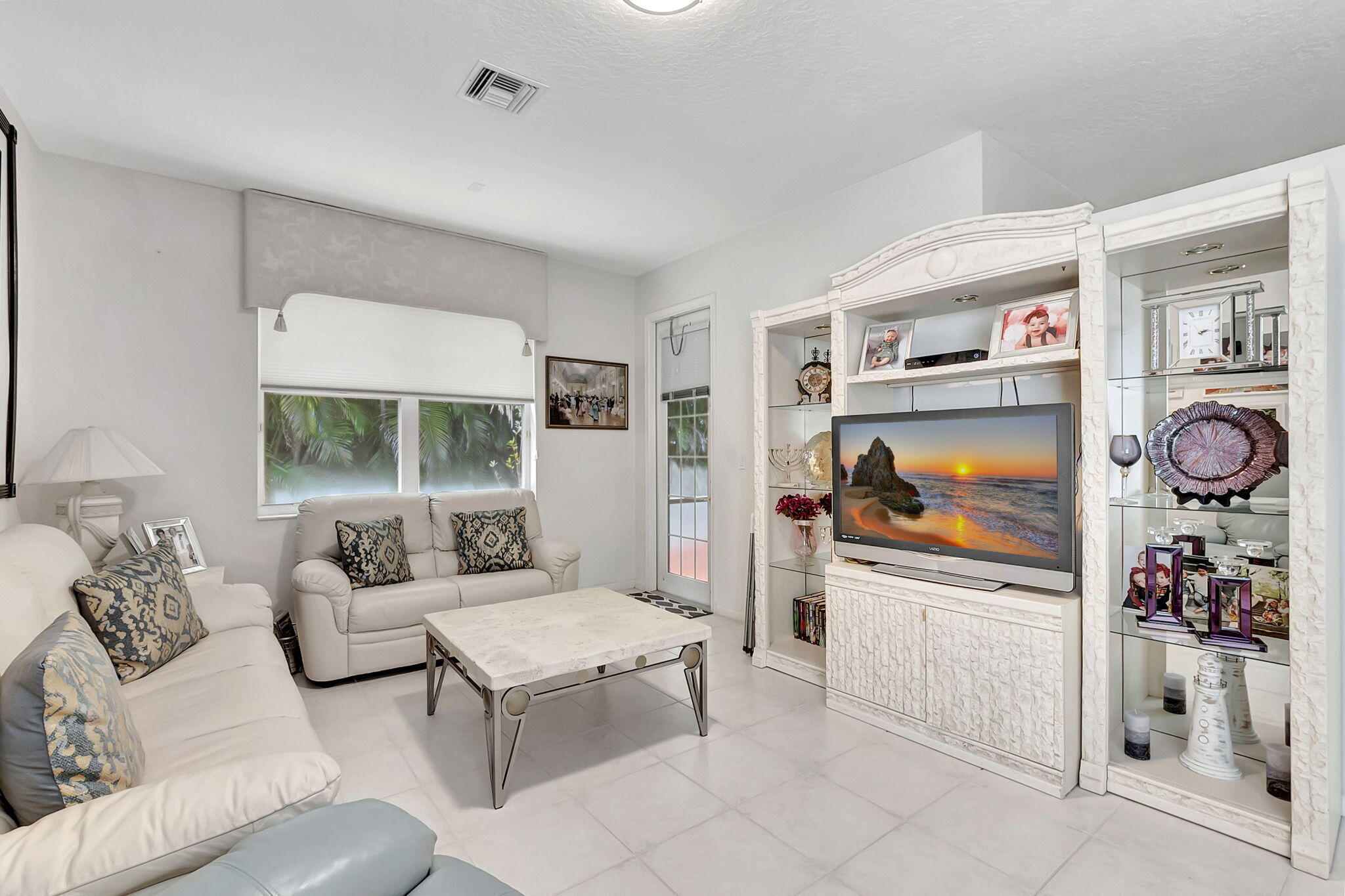 5916 Seashell Terrace Boynton Beach, FL 33437 - Photo 22 of 81 a living room with furniture and a flat screen tv