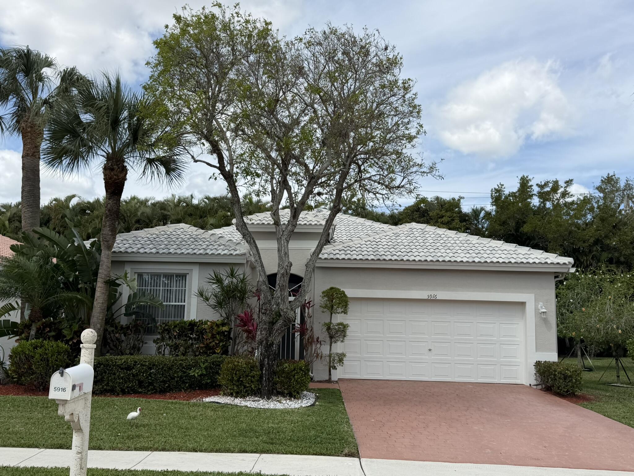 5916 Seashell Terrace Boynton Beach, FL 33437 - Photo 3 of 81 front view of house with a yard