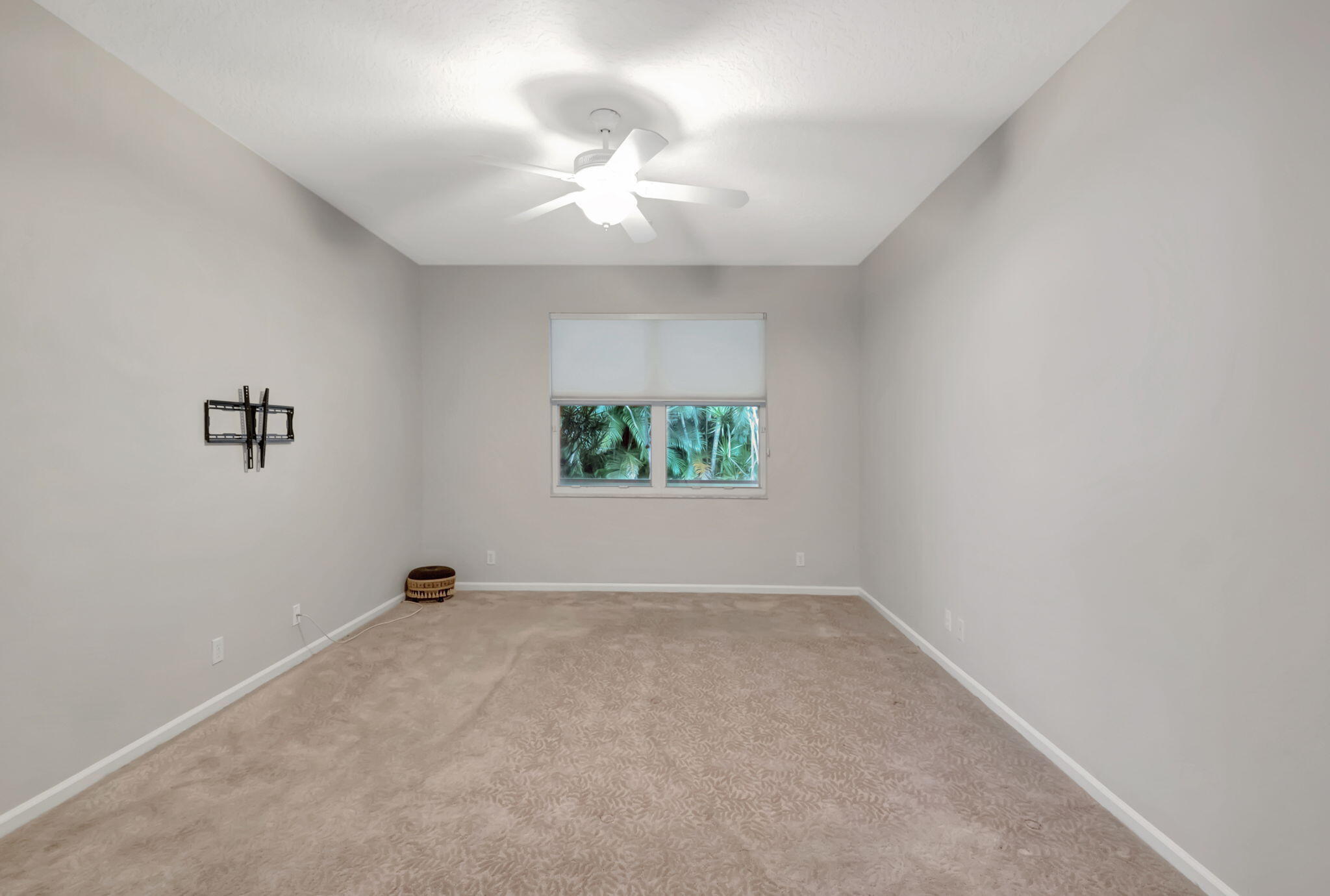 5916 Seashell Terrace Boynton Beach, FL 33437 - Photo 32 of 81 an empty room with windows and chandelier fan