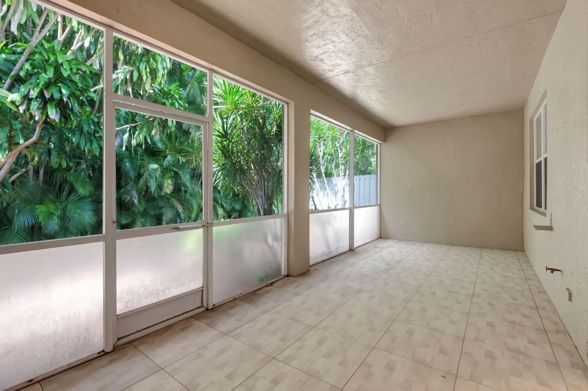5916 Seashell Terrace Boynton Beach, FL 33437 - Photo 47 of 81 a view of an empty room with a large window