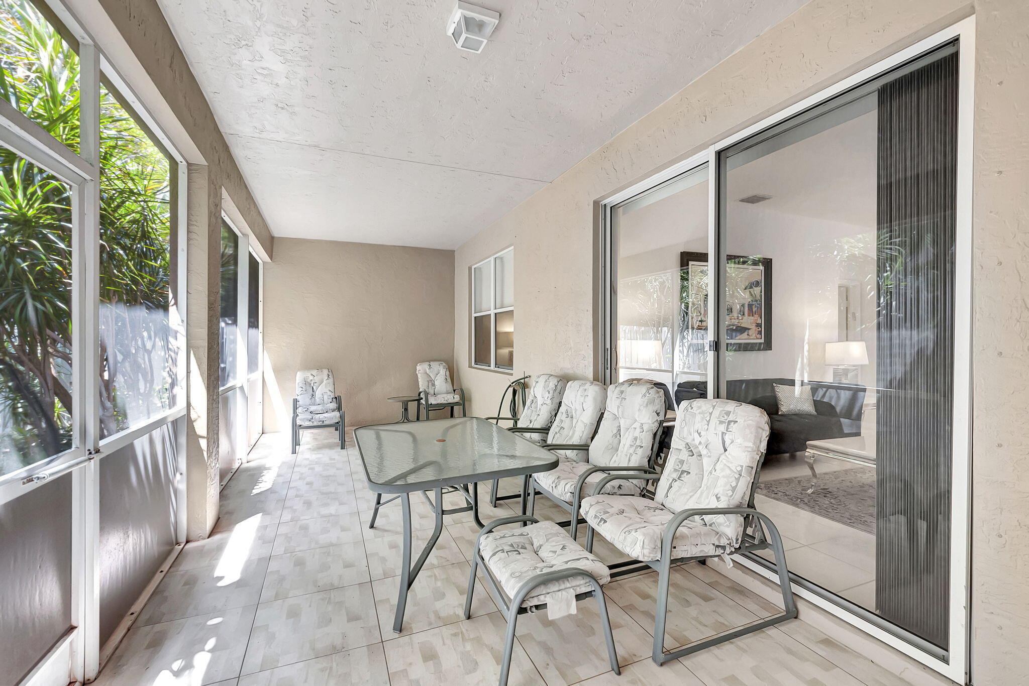 5916 Seashell Terrace Boynton Beach, FL 33437 - Photo 48 of 81 a dining room with furniture and large windows