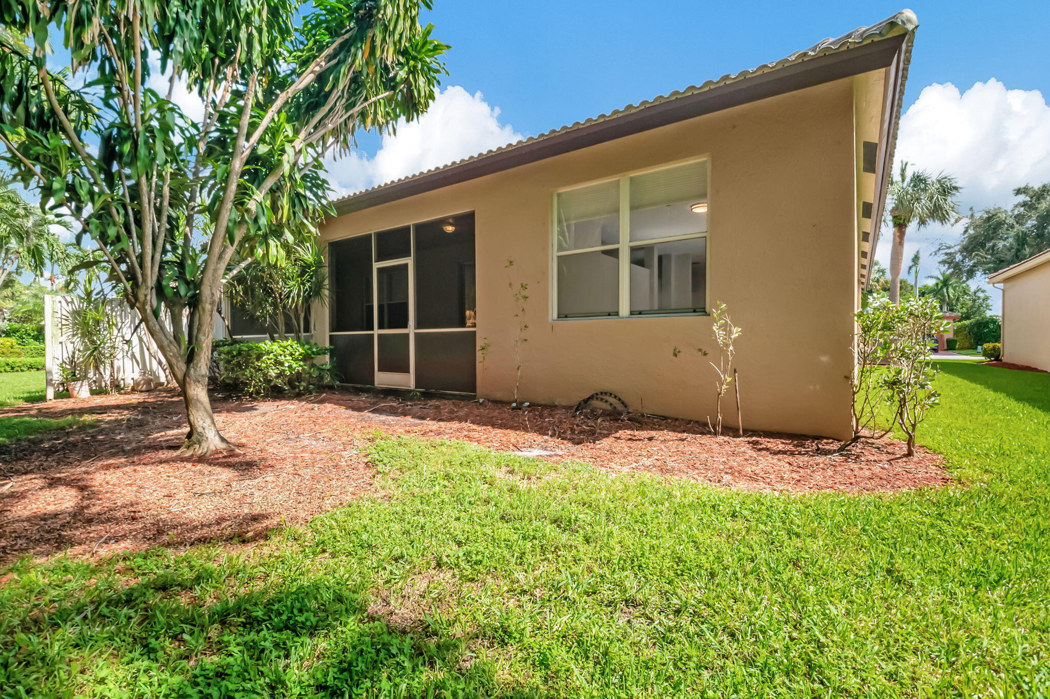 5916 Seashell Terrace Boynton Beach, FL 33437 - Photo 55 of 81 a backyard of a house with lots of green space