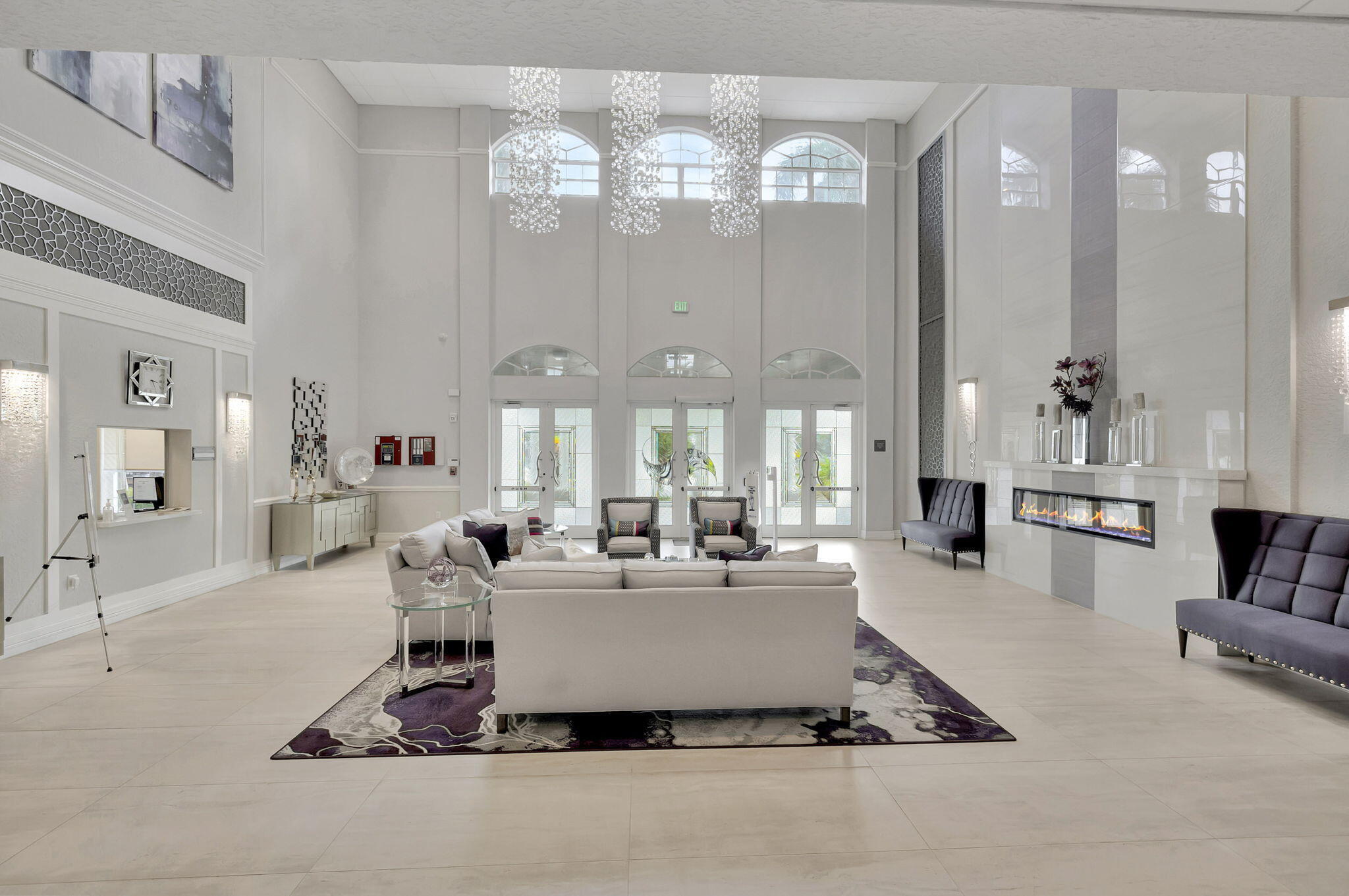5916 Seashell Terrace Boynton Beach, FL 33437 - Photo 66 of 81 a living room with fireplace furniture and a chandelier