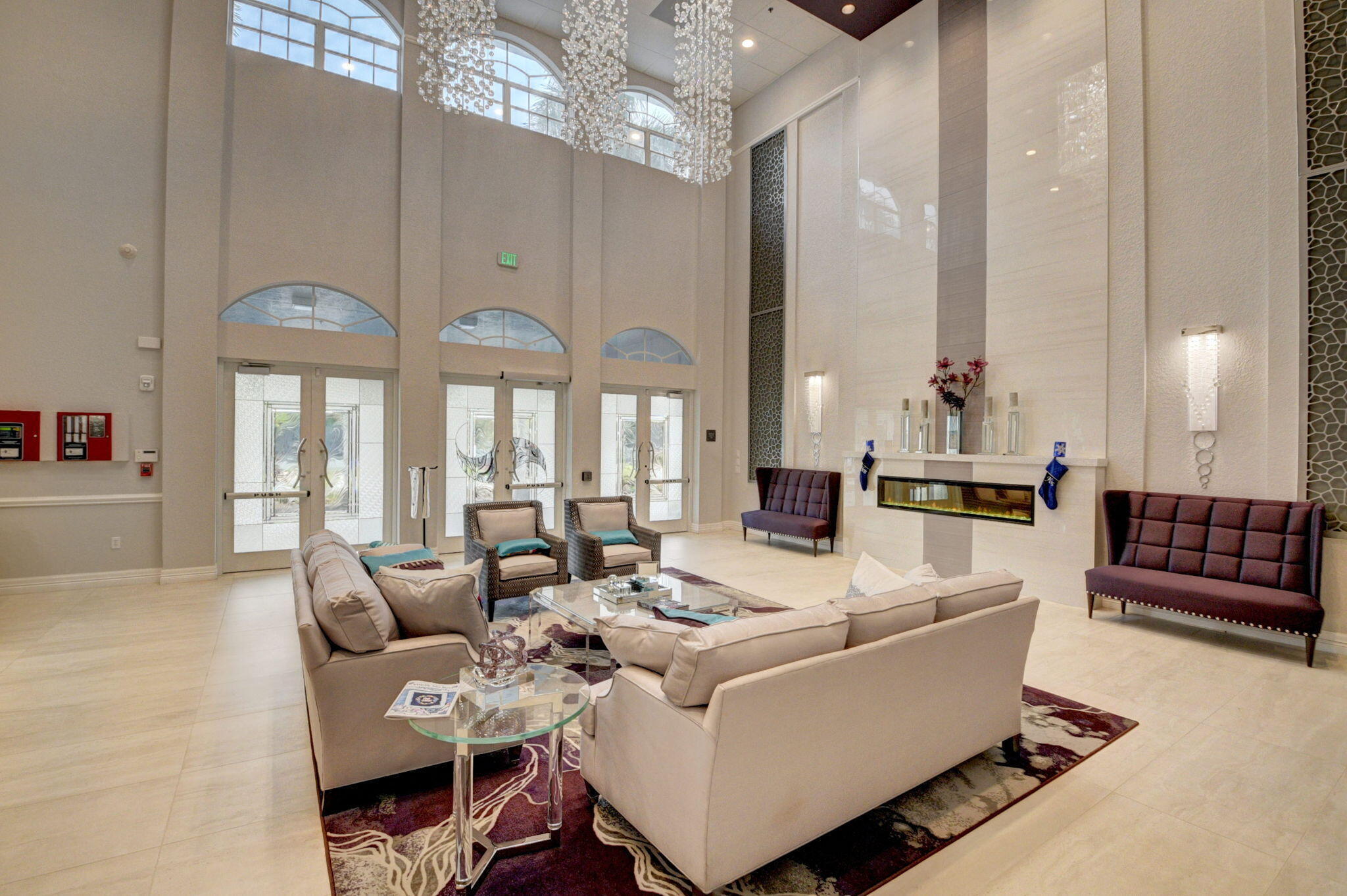 5916 Seashell Terrace Boynton Beach, FL 33437 - Photo 76 of 81 a living room with furniture fireplace and large windows