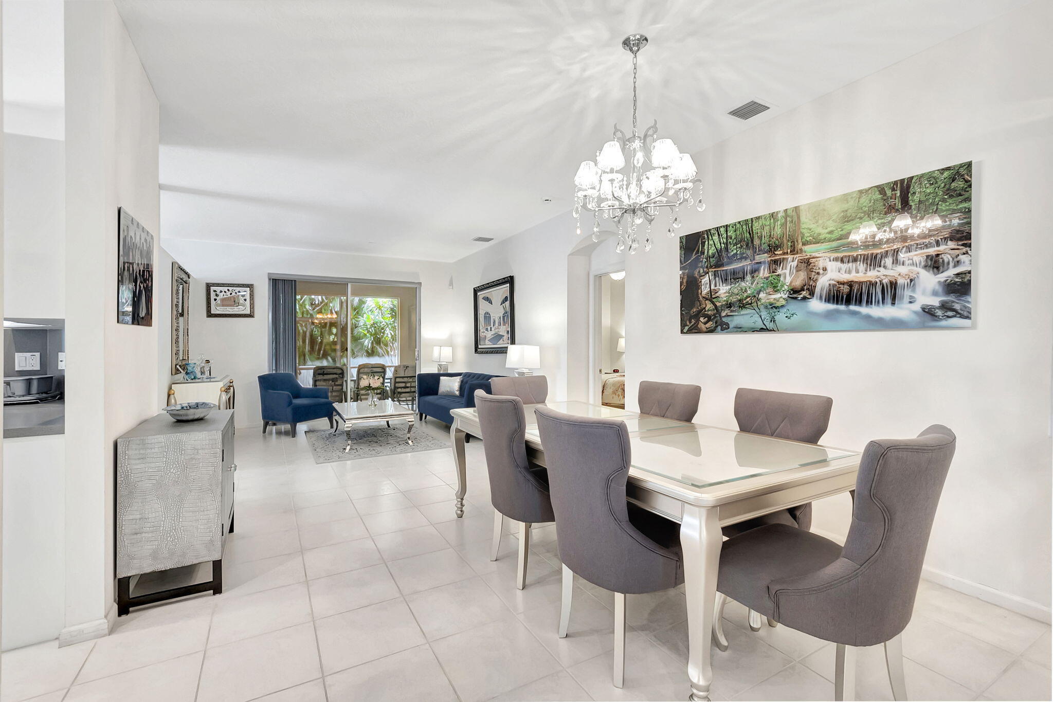 5916 Seashell Terrace Boynton Beach, FL 33437 - Photo 8 of 81 a view of a dining room with furniture a livingroom and chandelier