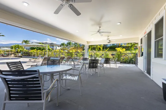 a view of an entryway with wooden floor and a livingroom view