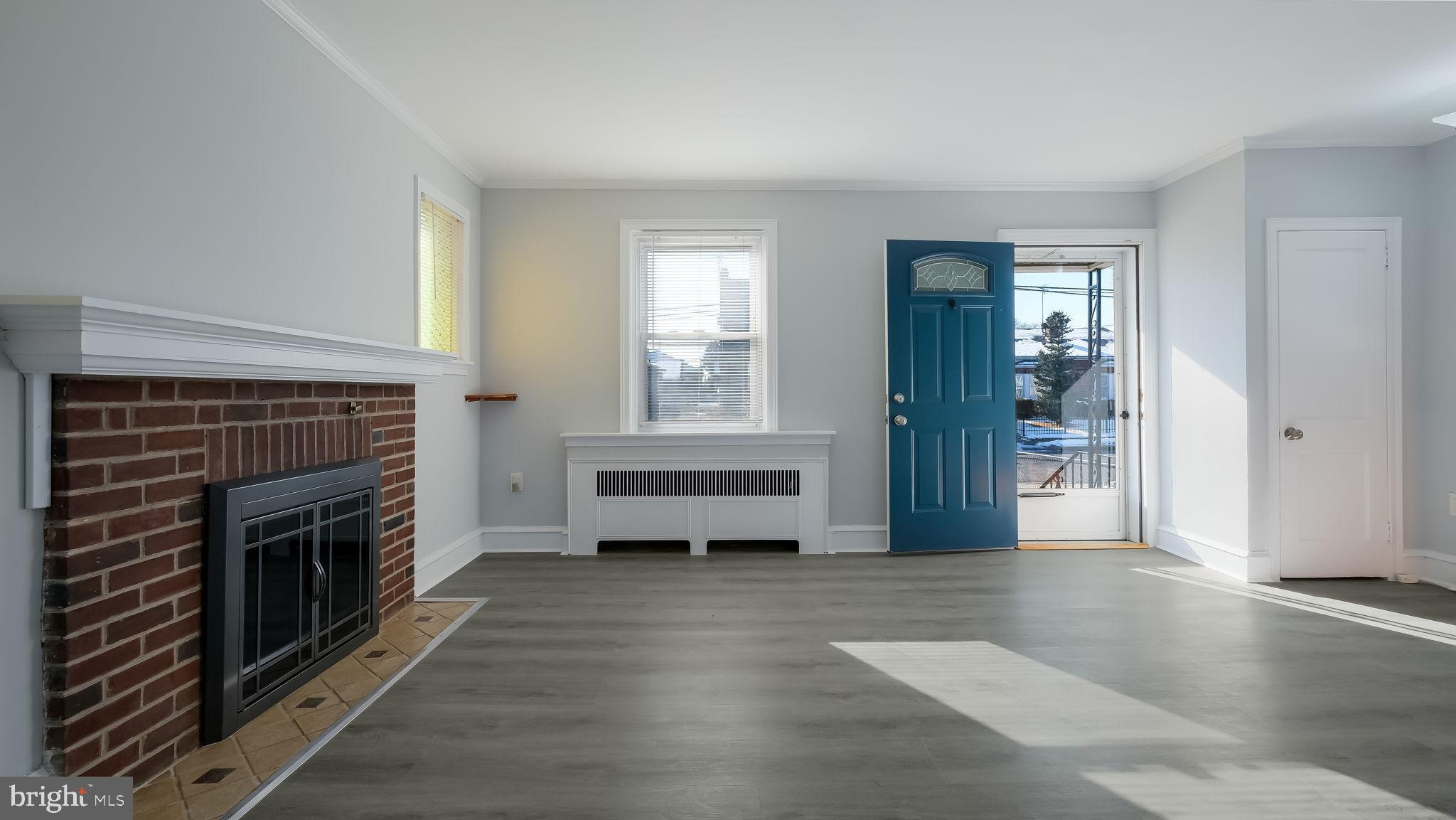 2035 Ripley Street Philadelphia, PA 19152 - Photo 11 of 30 a view of a livingroom with wooden floor and a fireplace