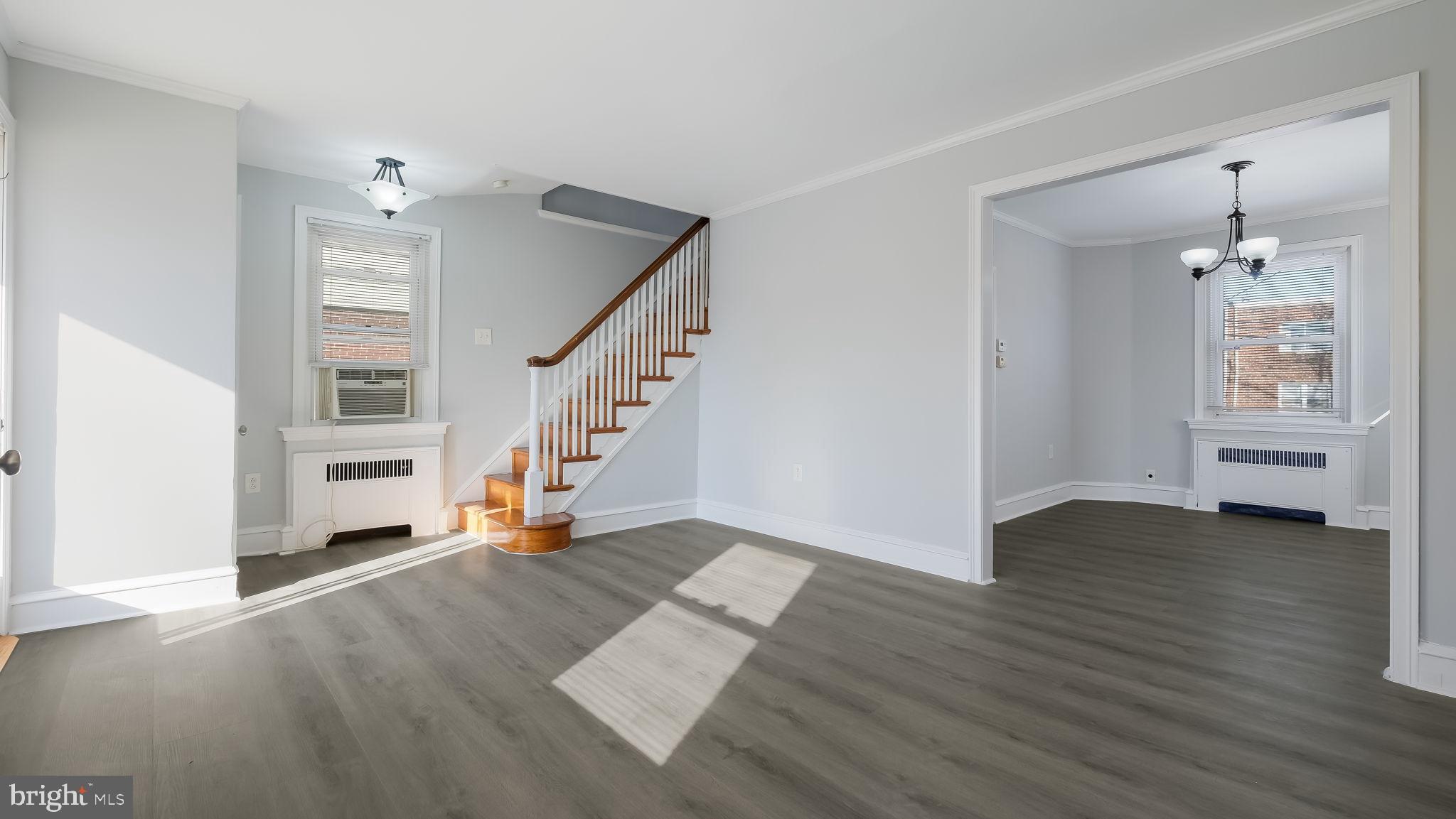 2035 Ripley Street Philadelphia, PA 19152 - Photo 13 of 30 a view of an empty room with wooden floor and stairs