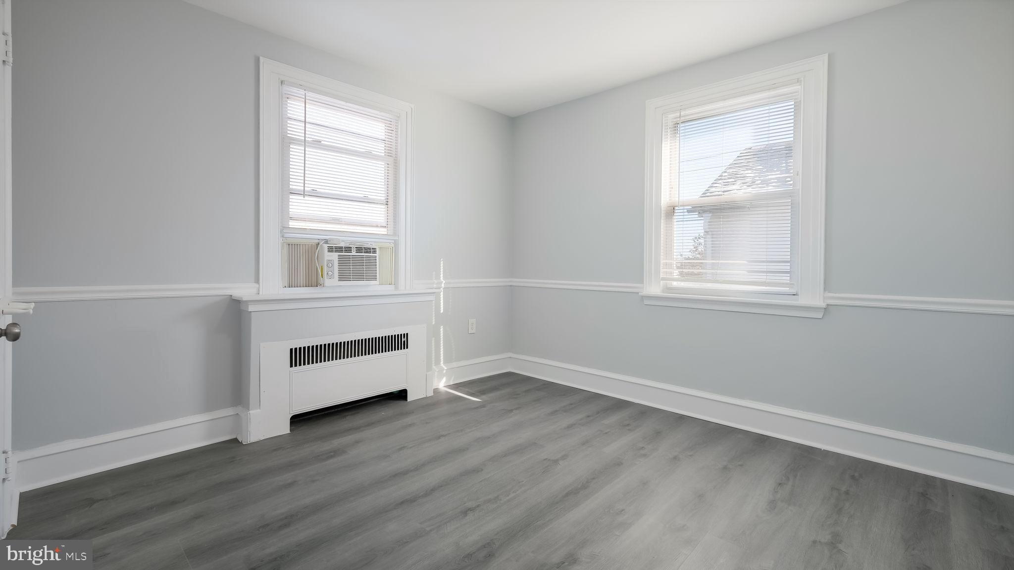 2035 Ripley Street Philadelphia, PA 19152 - Photo 15 of 30 an empty room with wooden floor and windows
